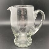 Glass jug with chiseled pattern