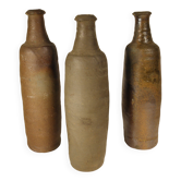 Lot of three old Norman stoneware bottles