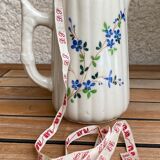 Small pitcher in iron earth with double old decoration