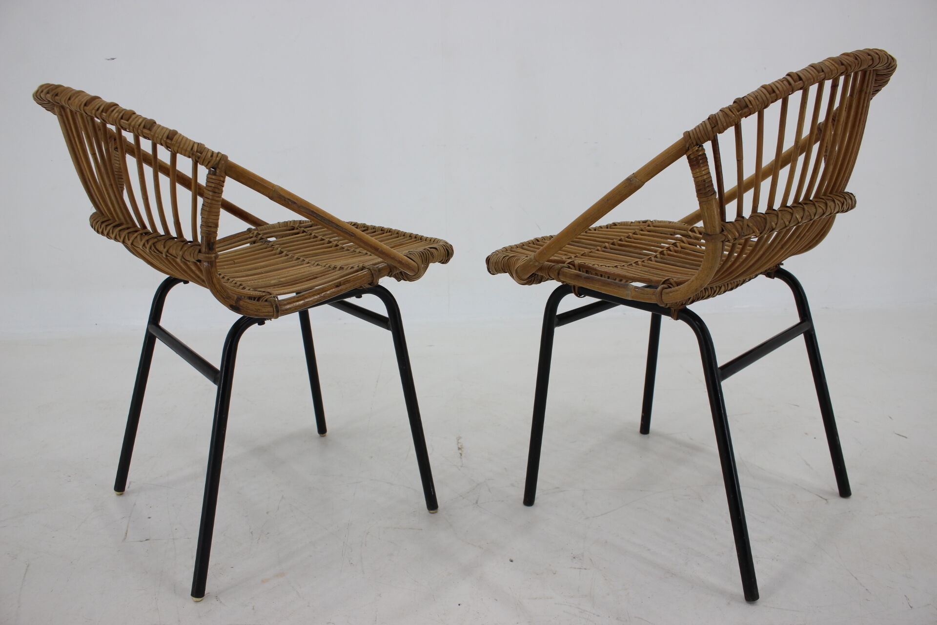 1970s pair of Alan Fuchs rattan and iron lounge chairs, Czechoslovakia