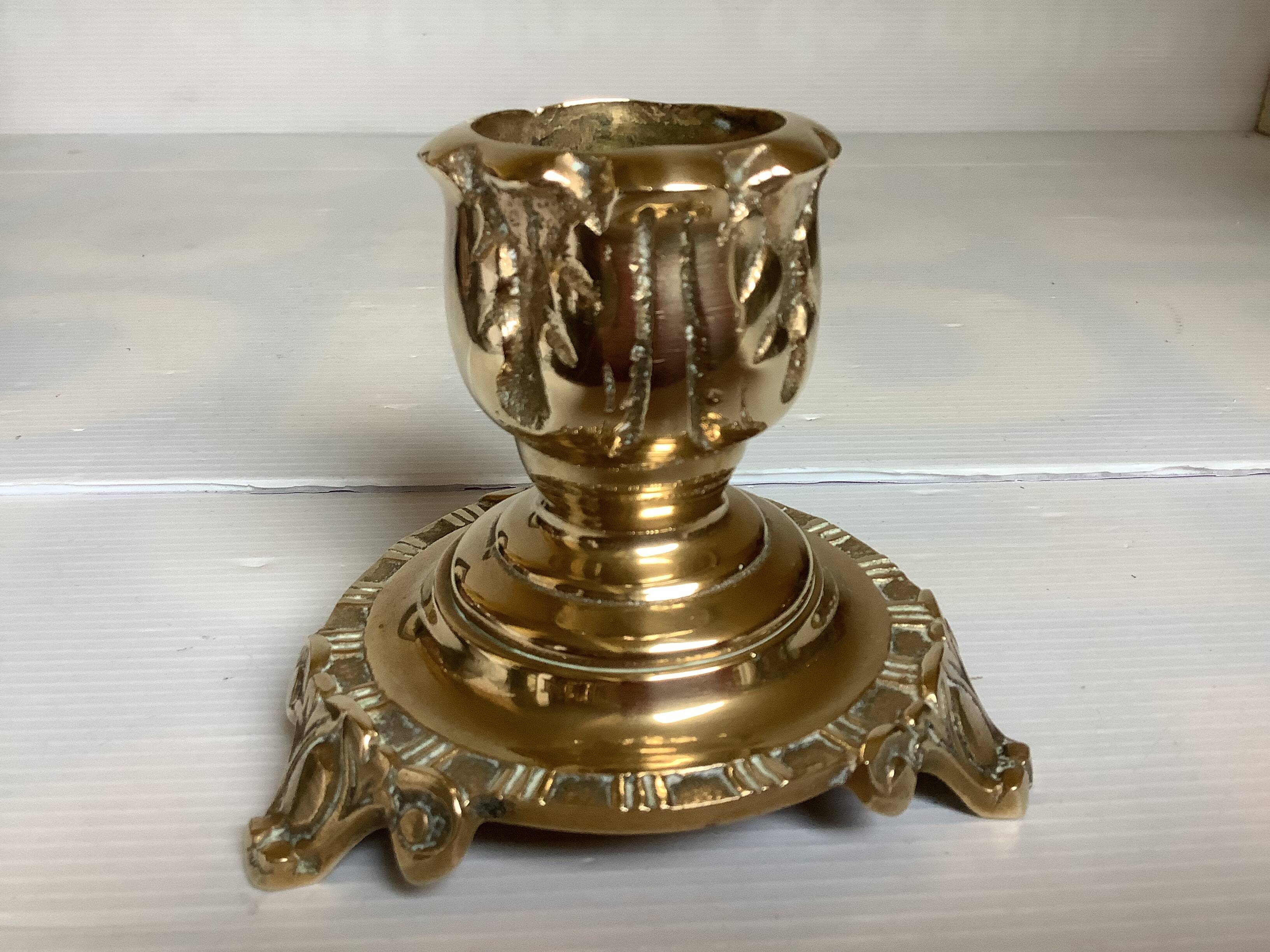 Tripod candlestick in worked bronze