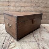 Teak chest from Burma with carved rosettes.
