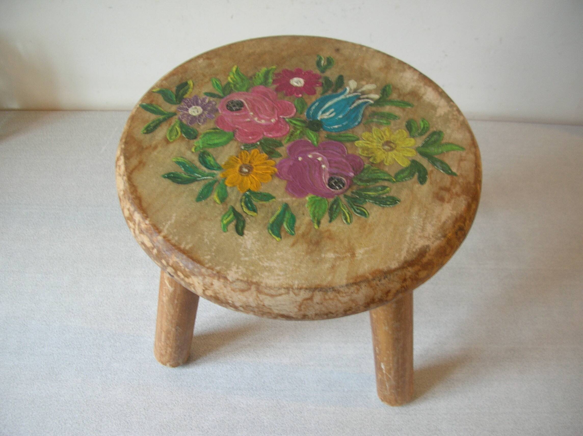 Old tripod stool with 3 wooden legs, painted floral decoration, flower bouquet