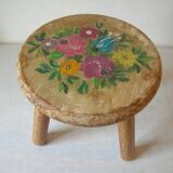 Old tripod stool with 3 wooden legs, painted floral decoration, flower bouquet