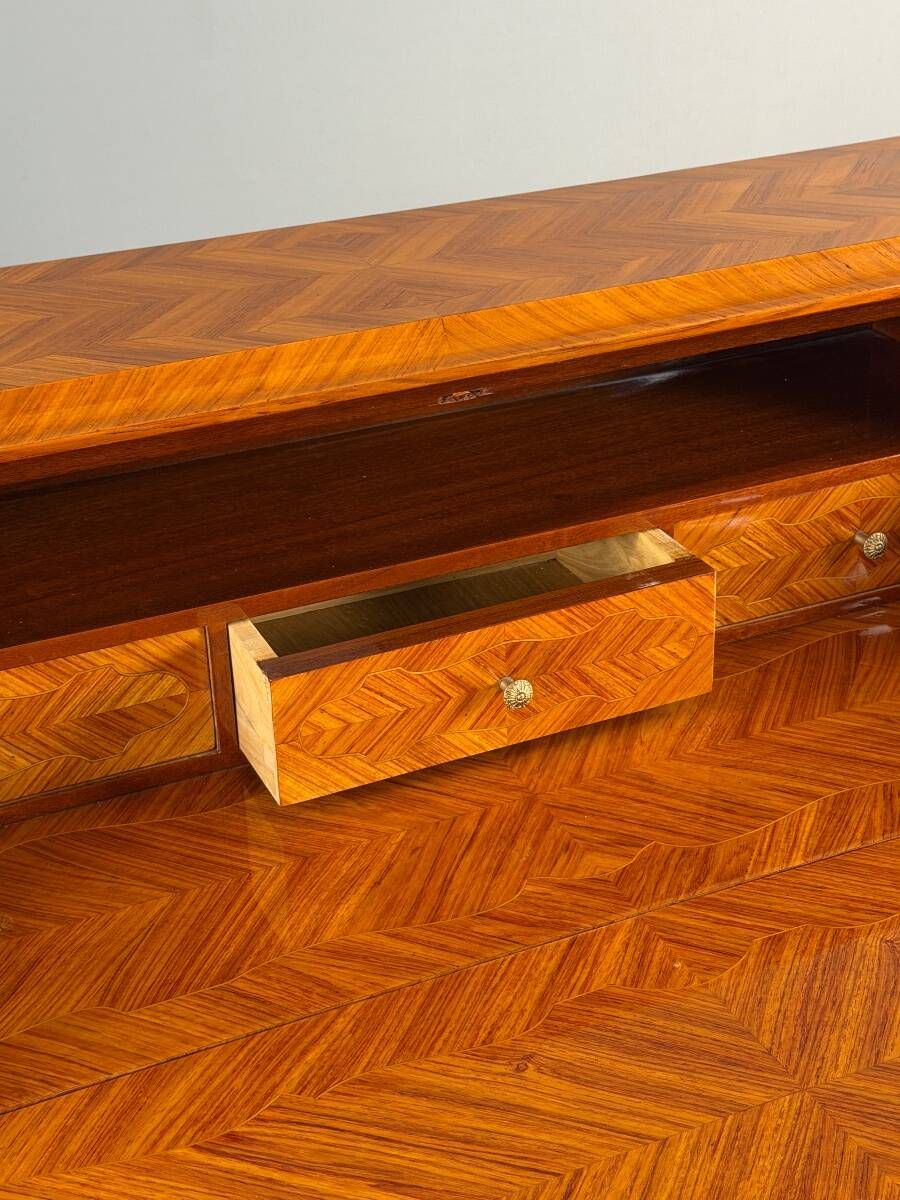 Louis XV style writing desk with a drop-leaf, made of veneer and marquetry, 19th century.