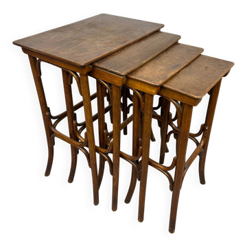 Nest tables in curved wood by Thonet.