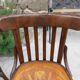 4 bentwood bistro chairs with a pattern on the seat