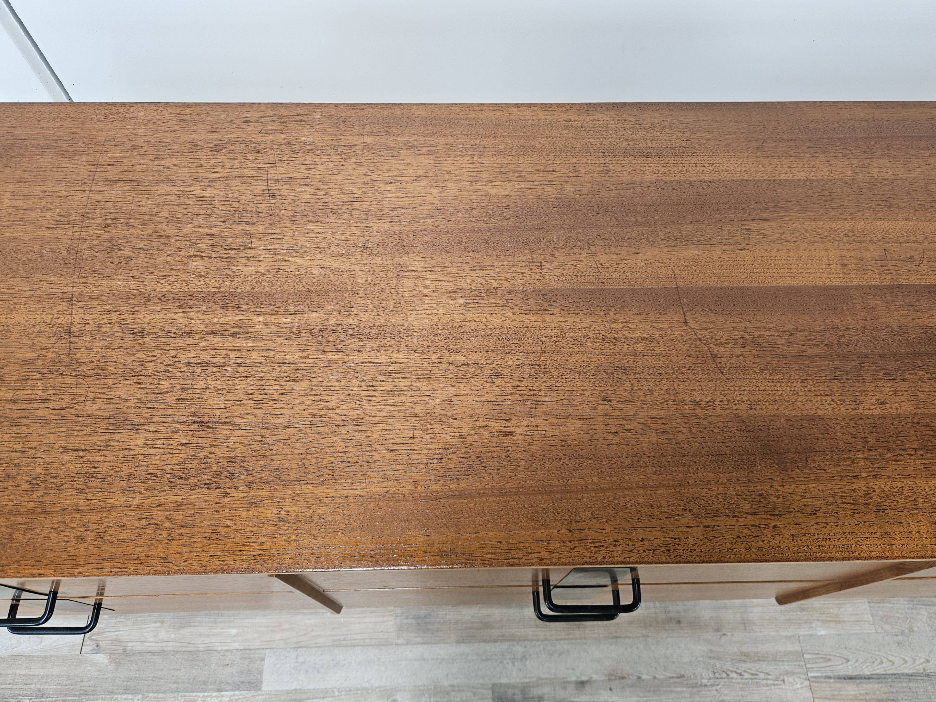 1960s walnut chest of drawers with iron and brass details