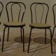 4 Black metal bistro chairs with plastic cane seat