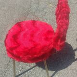 Red furry chairs and pouffe