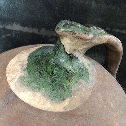 Large old jug cooked buried