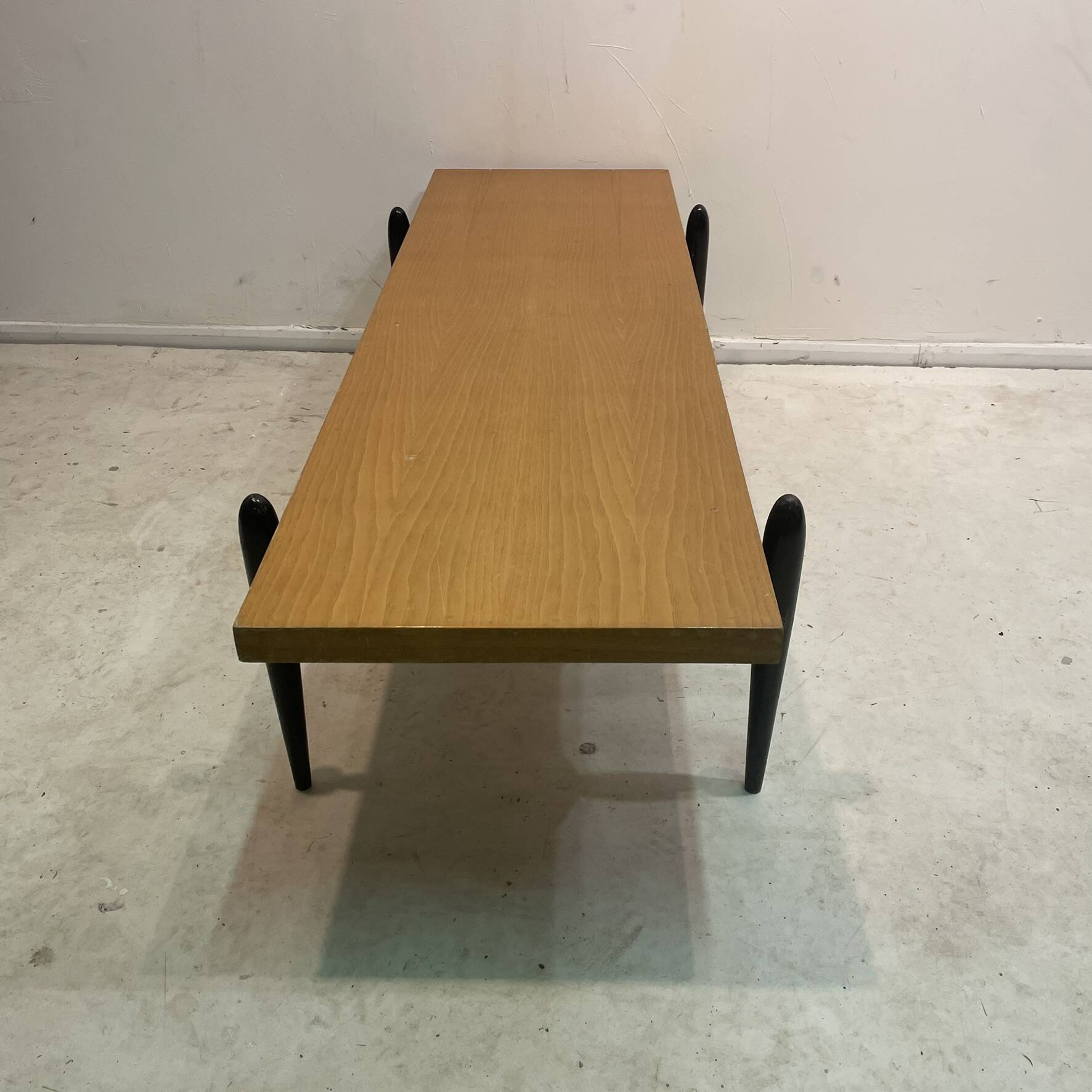 Large 1950s modernist coffee table – sculptural black base
