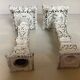 Pair of patinated cast iron candlesticks