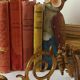 Pair of antique wall-mounted brass candle holders