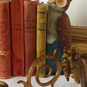 Pair of antique wall-mounted brass candle holders
