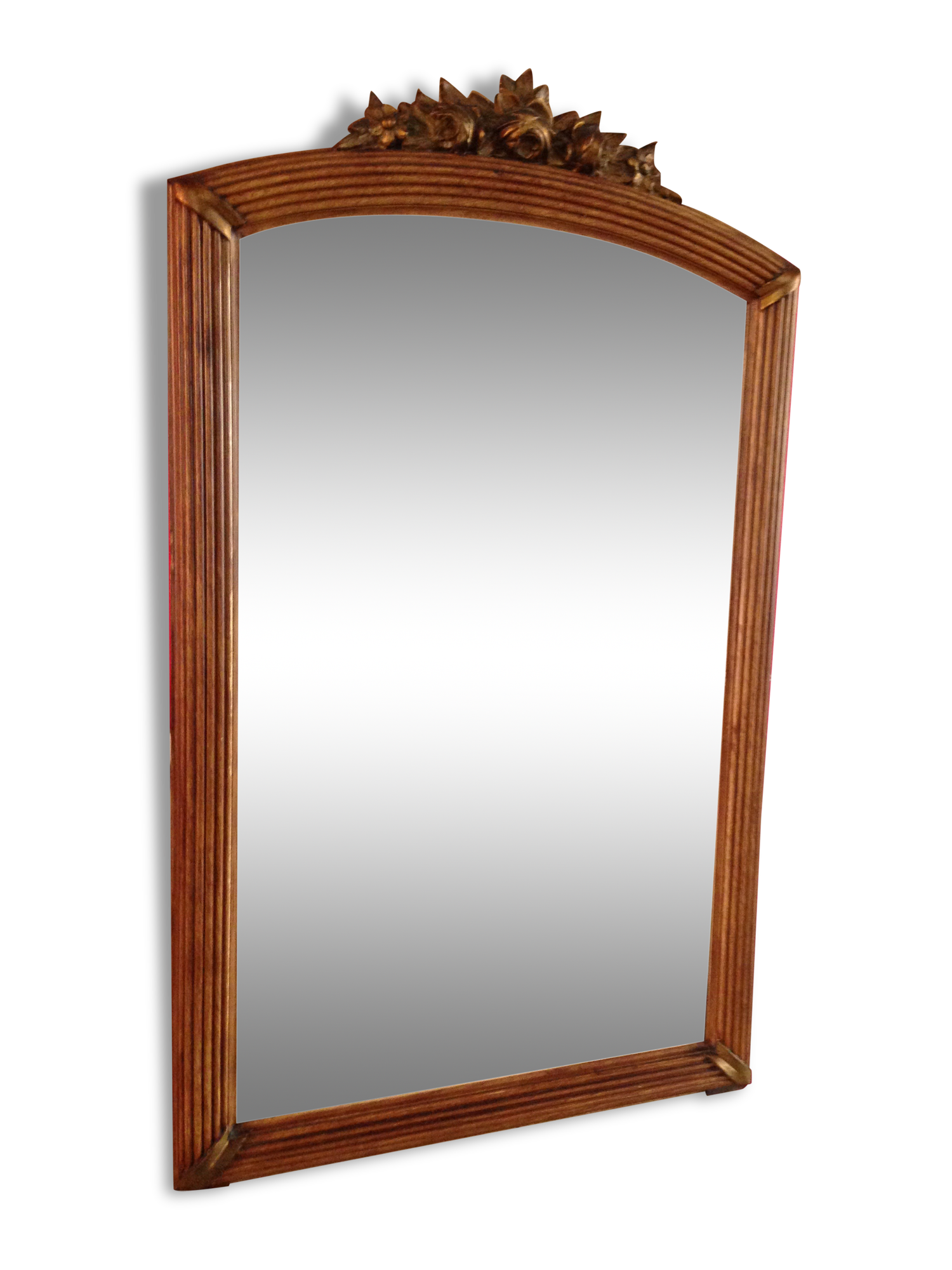 Mirror adorned with sculpted flowers