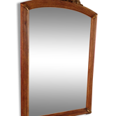 Mirror adorned with sculpted flowers