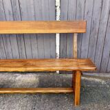 Brutalist bench with dark wood backrest