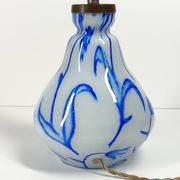 Antique table lamp in opaline glass with blue floral decoration.