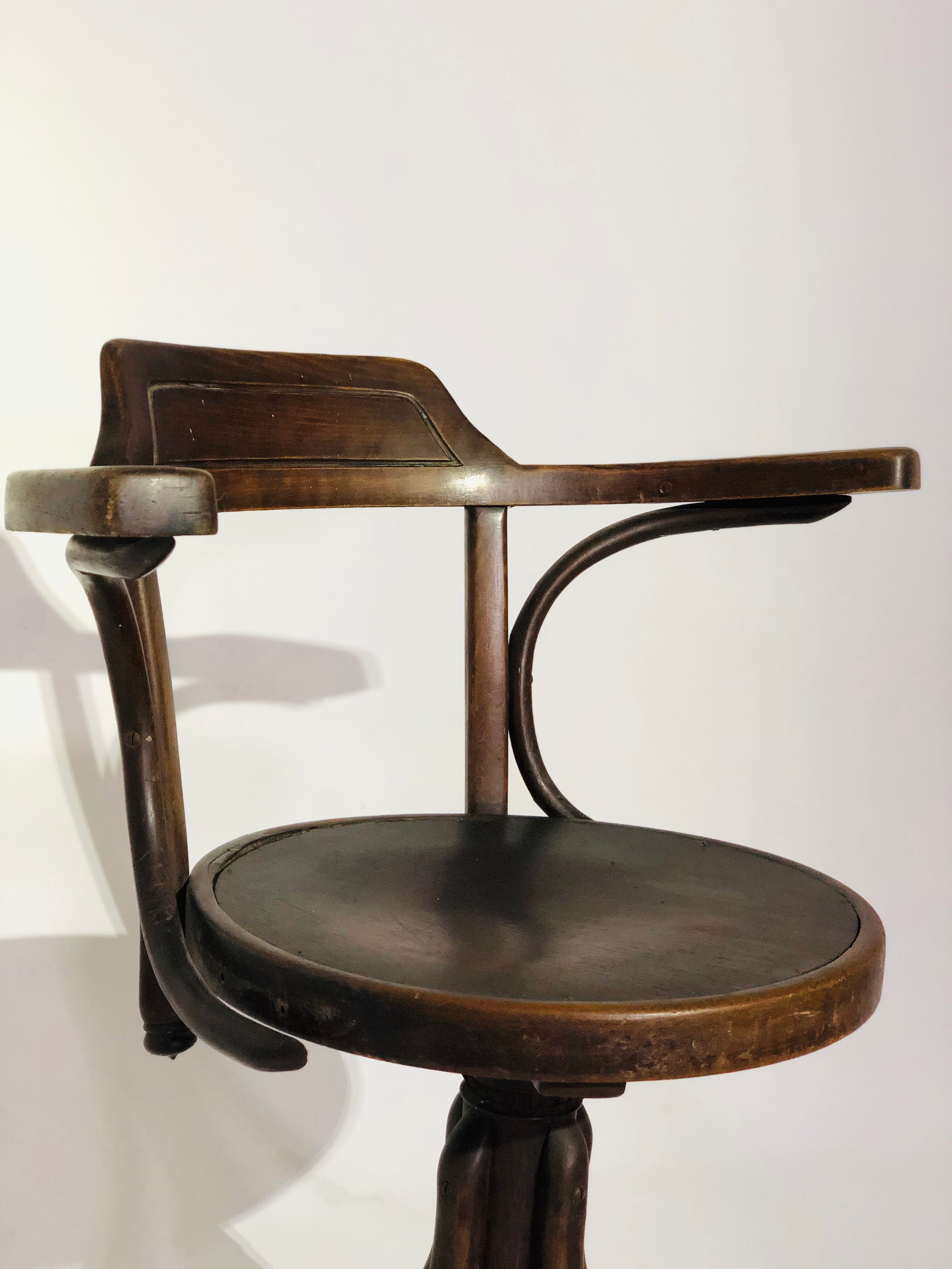 Swivel wooden armchair