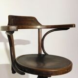 Swivel wooden armchair