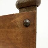 Curule armchair in wrought iron and leather