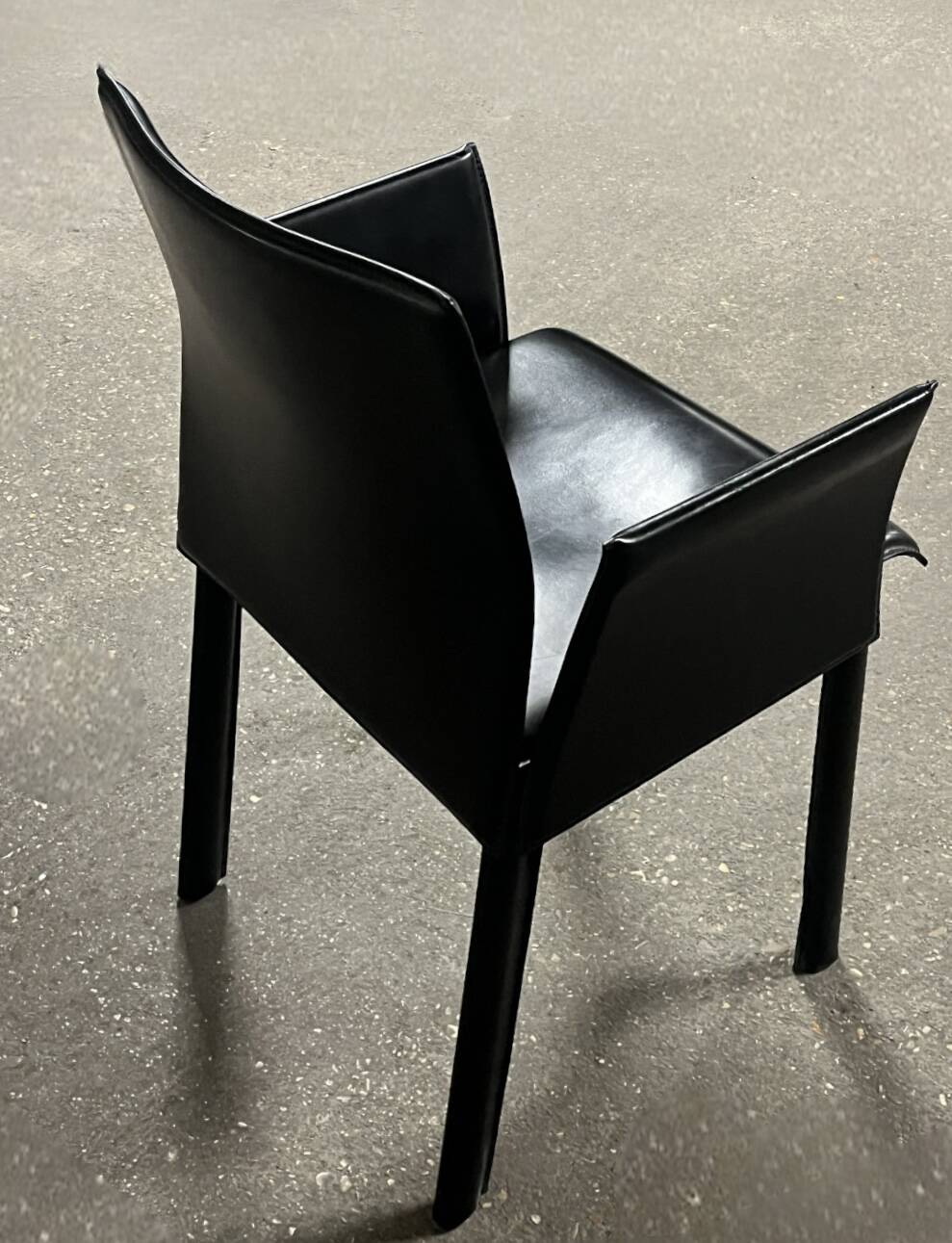 Office chair with armrests in thick black leather, Cattelan Italy.