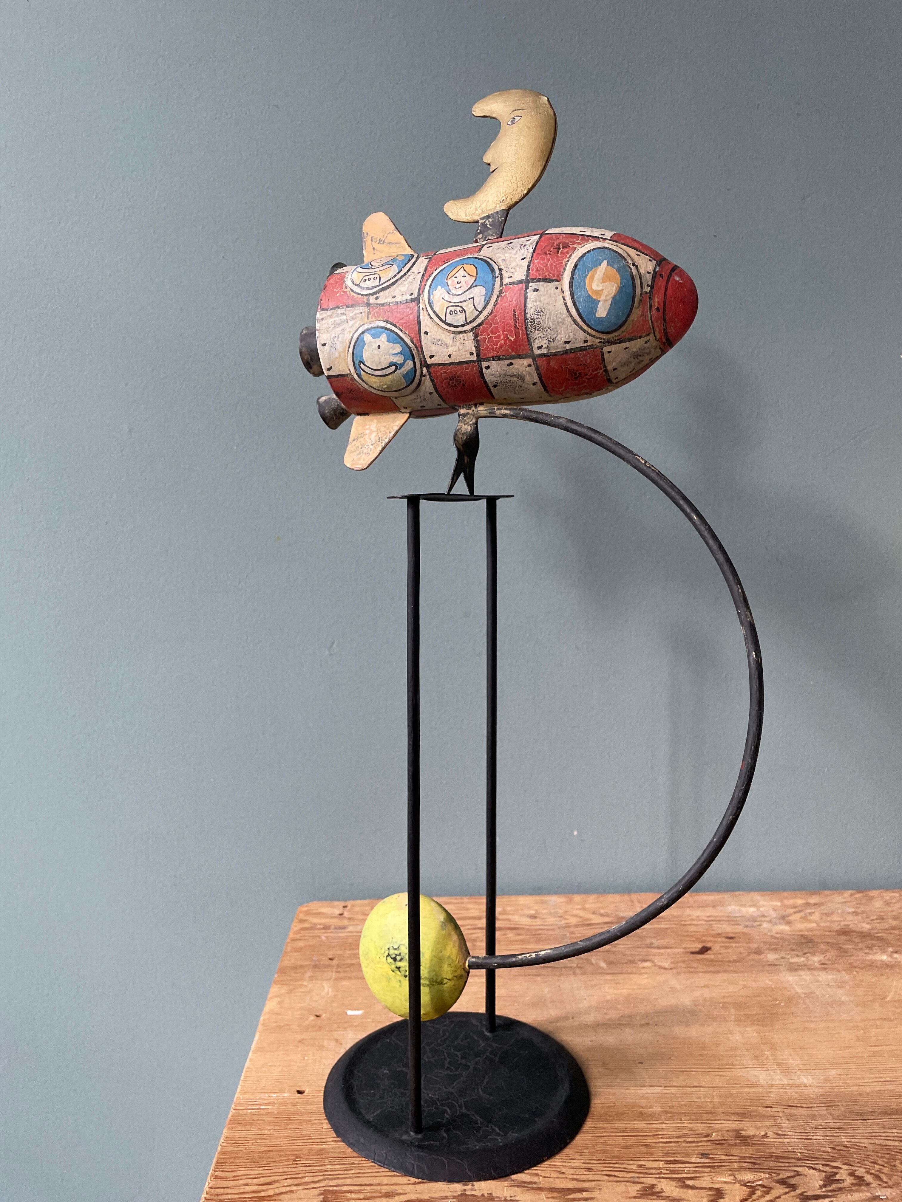 Old painted sheet metal pendulum toy