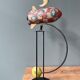 Old painted sheet metal pendulum toy
