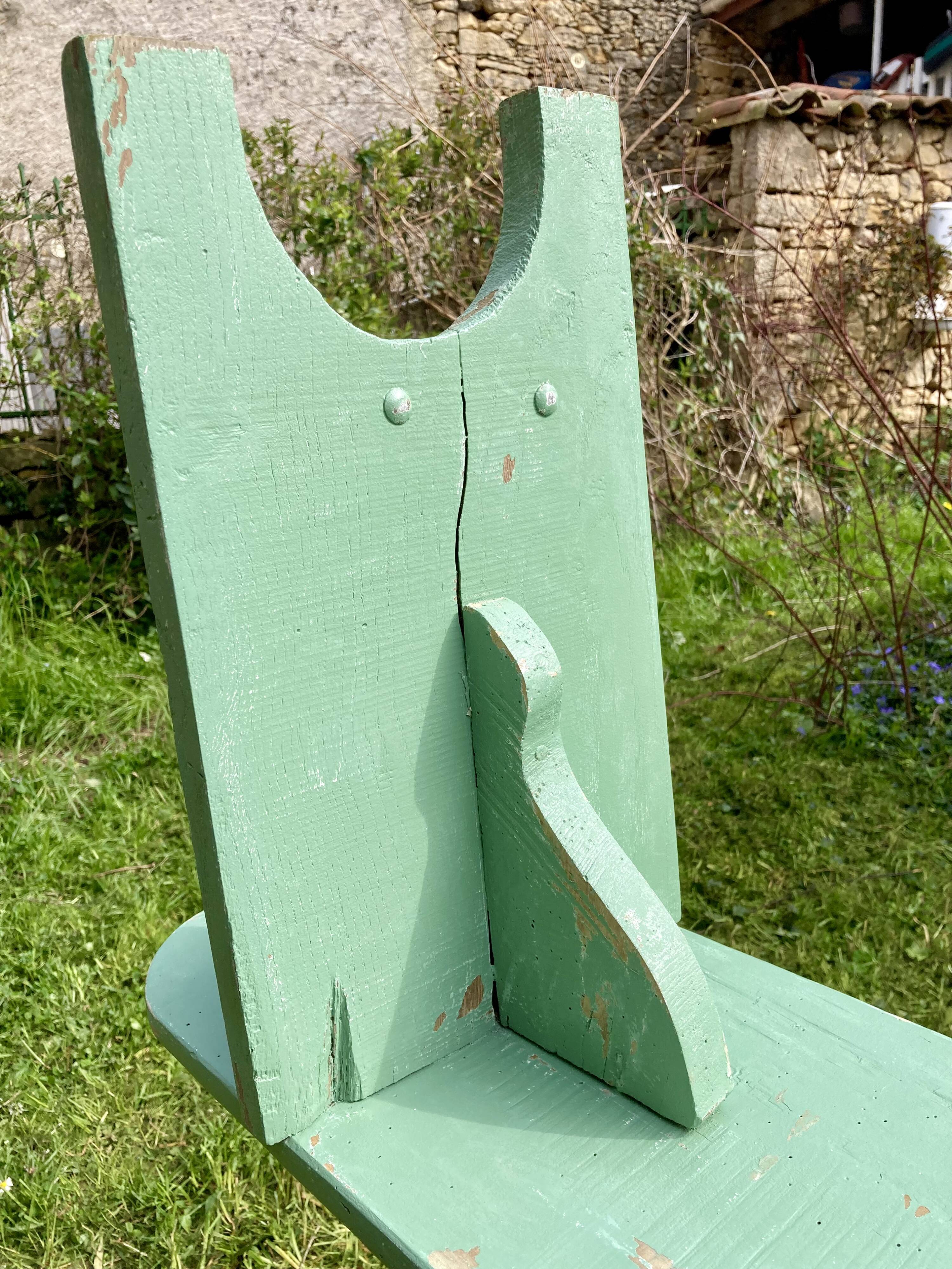 Old curved wooden farm bench