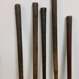 Old golf bag with 5 golf clubs