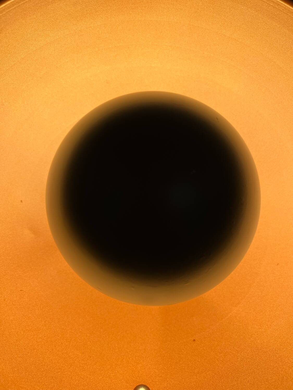 Vintage industrial lamp with a metal frame.