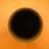 Vintage industrial lamp with a metal frame.