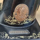 Old Singer sewing machine on pedestal