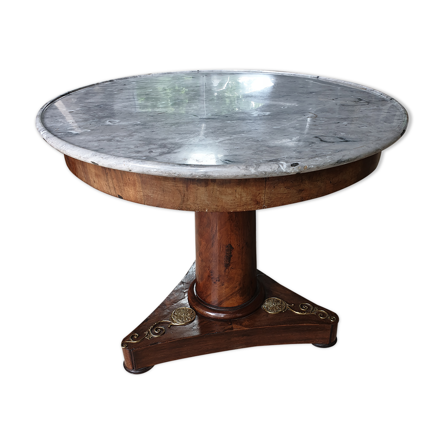 Pedestal table above marble