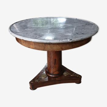 Pedestal table above marble
