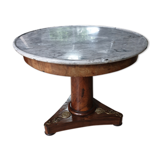 Pedestal table above marble