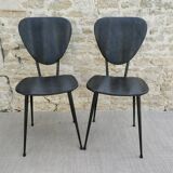 Pair of chairs with tapered metal legs and black Skaï, 60s