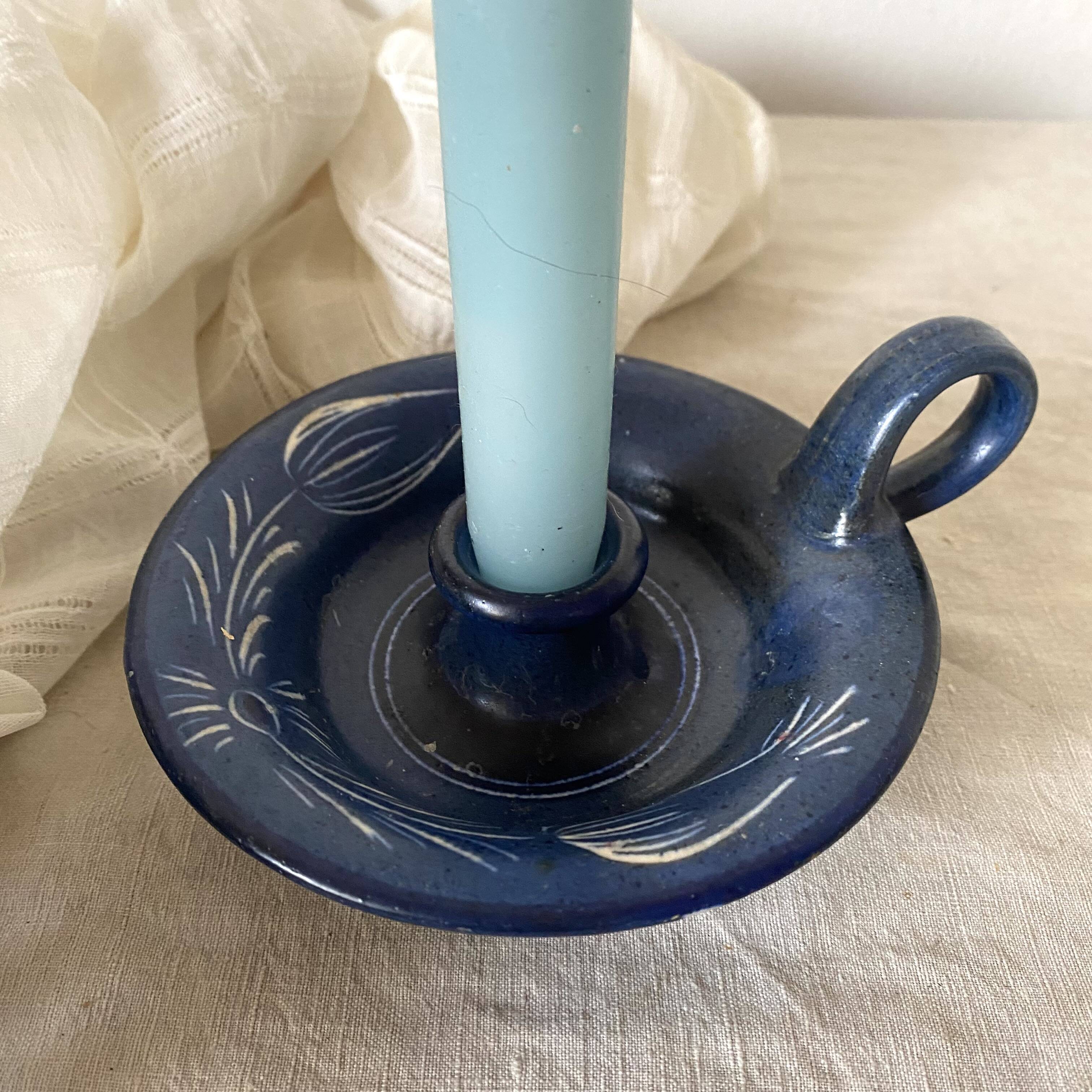 Signed terracotta thumb candle holder