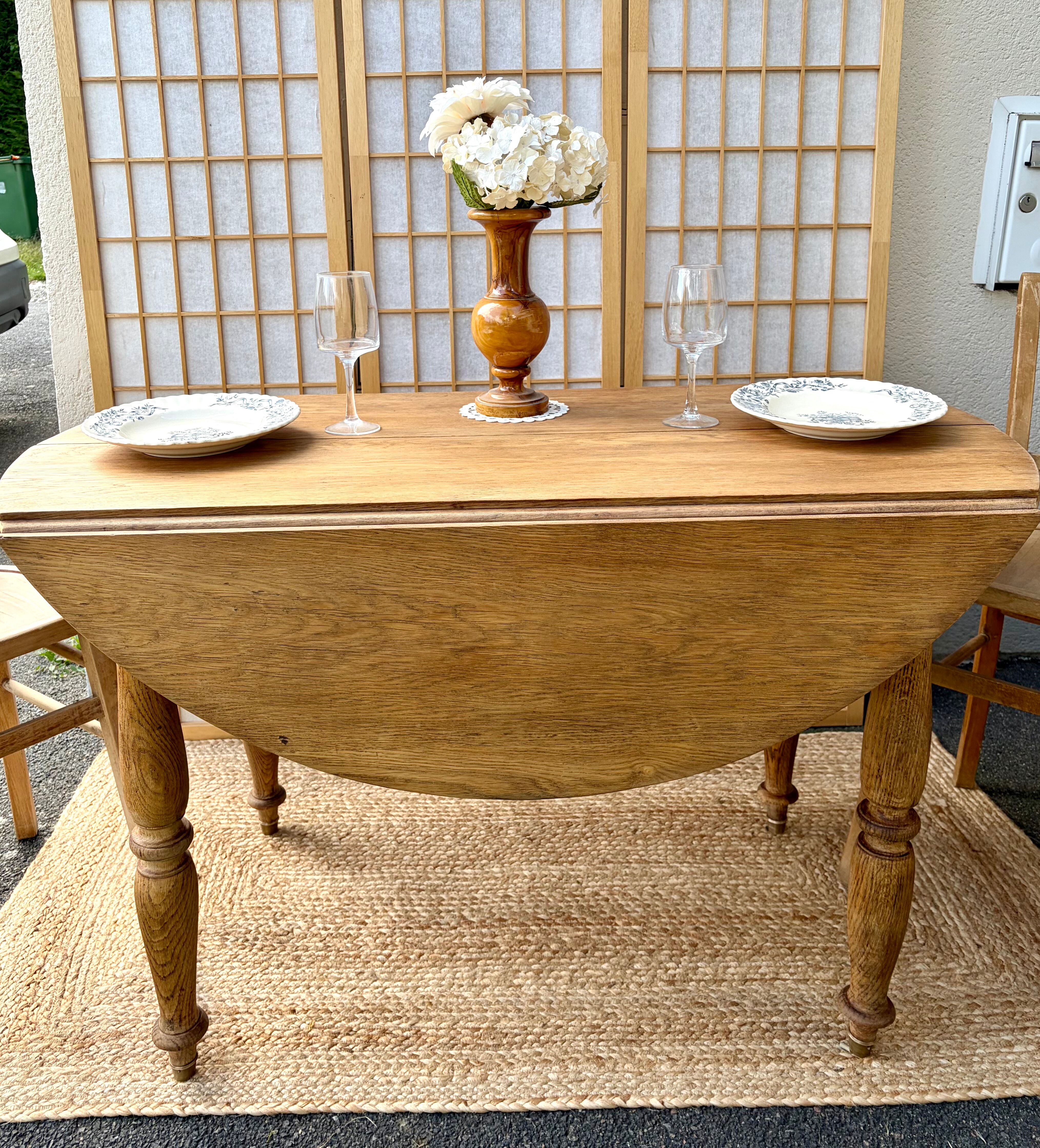 Round oak table with a drop leaf.