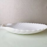 White ceramic dish shaped like 80s shells