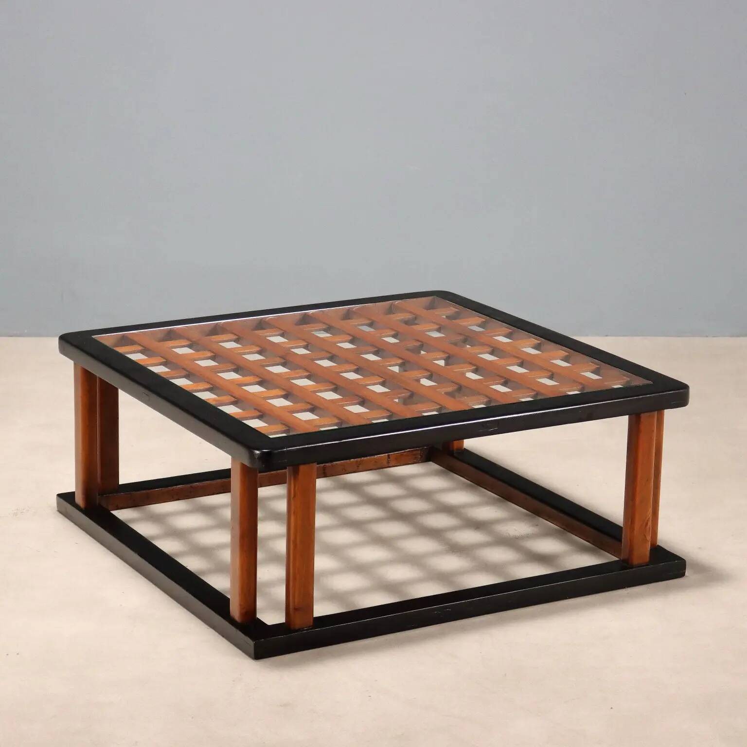 Vintage wooden coffee table with paint and glass, design from the 1940s-50s.