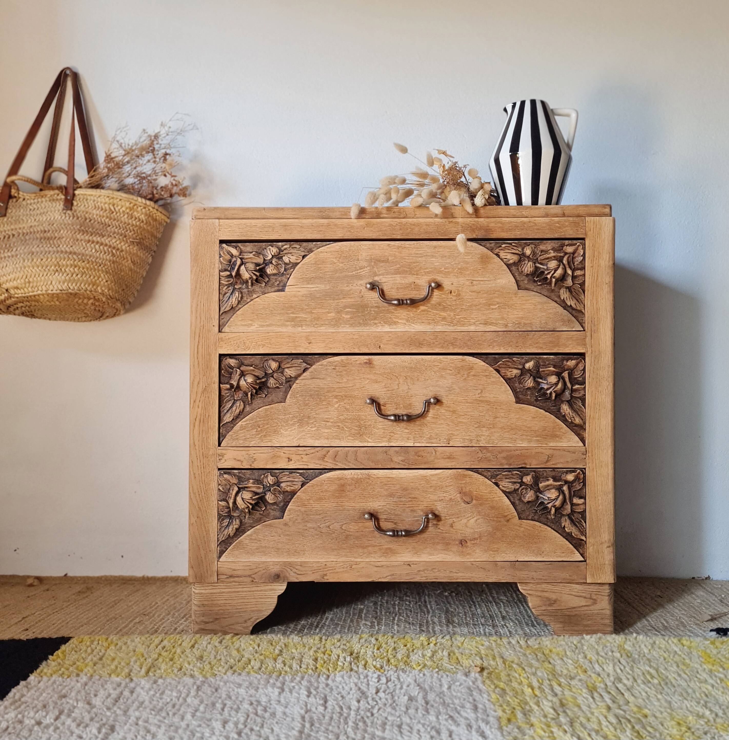Art Deco chest of drawers in raw oak with carved drawers.