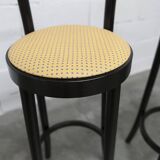 Pair of Baumann Dialog model stools in black and yellow and blue imitation leather, 1990