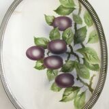 Vintage earthenware tray surrounded by antique metal