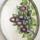 Vintage earthenware tray surrounded by antique metal