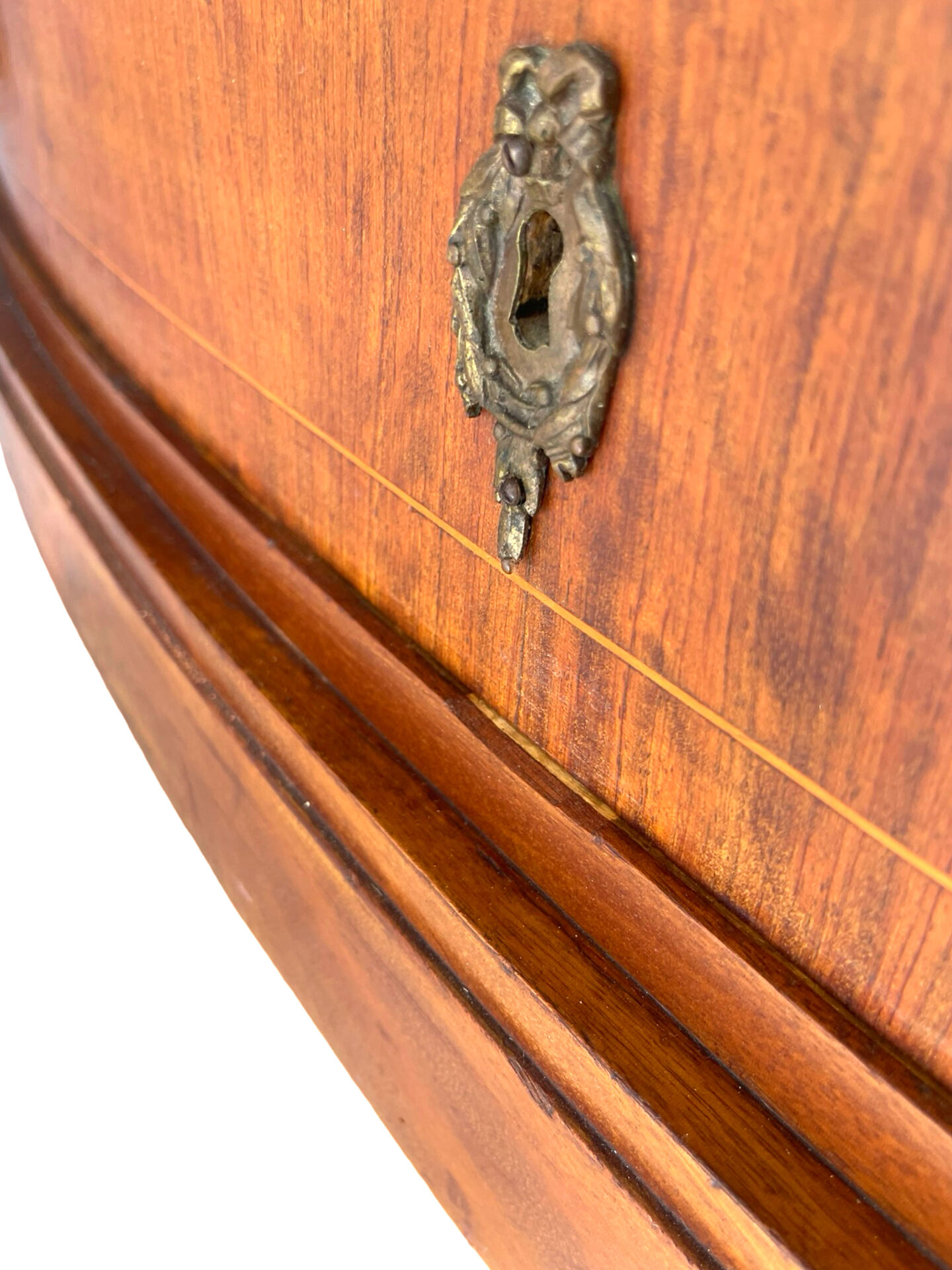 The demi-lune commode/ chest of drawers
