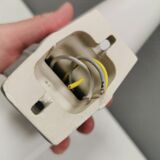 Bathroom lamp with light gray ceramic base,  and milky white opal glass.