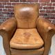 Brown leather armchair