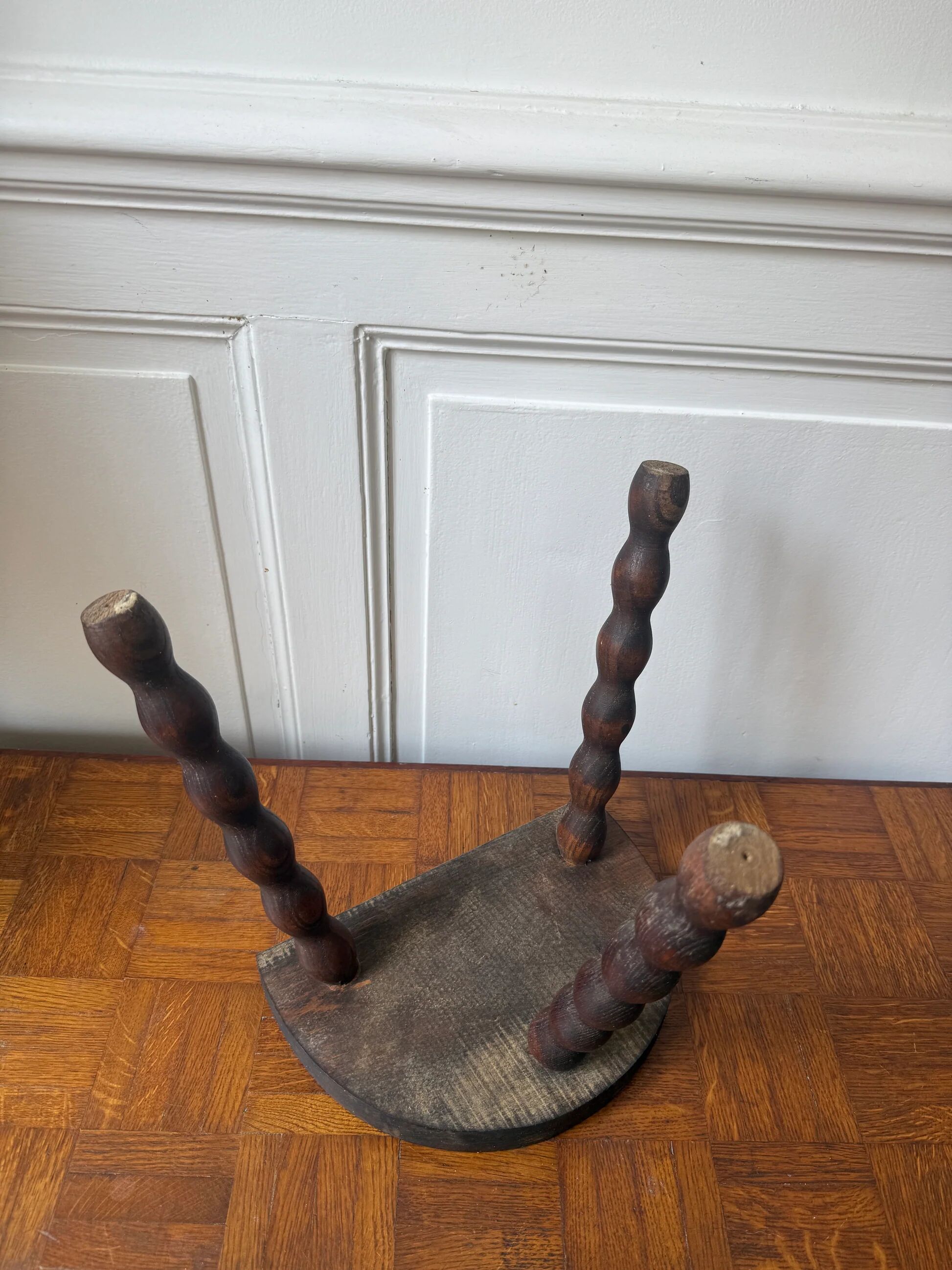 Three-legged turned wooden stool